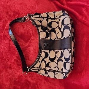 Black and gray coach purse